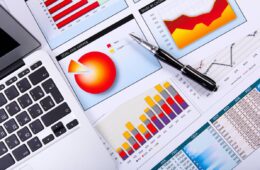 Financial paper charts and graphs on the table